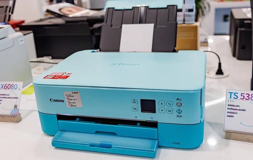 Canon Pixma inkjet printer producing a vivid color photograph print