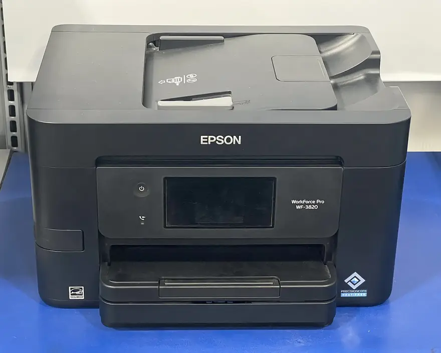 Epson EcoTank printer with transparent refillable ink reservoirs on the front