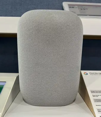 Google Nest Audio smart speaker on a retail display shelf