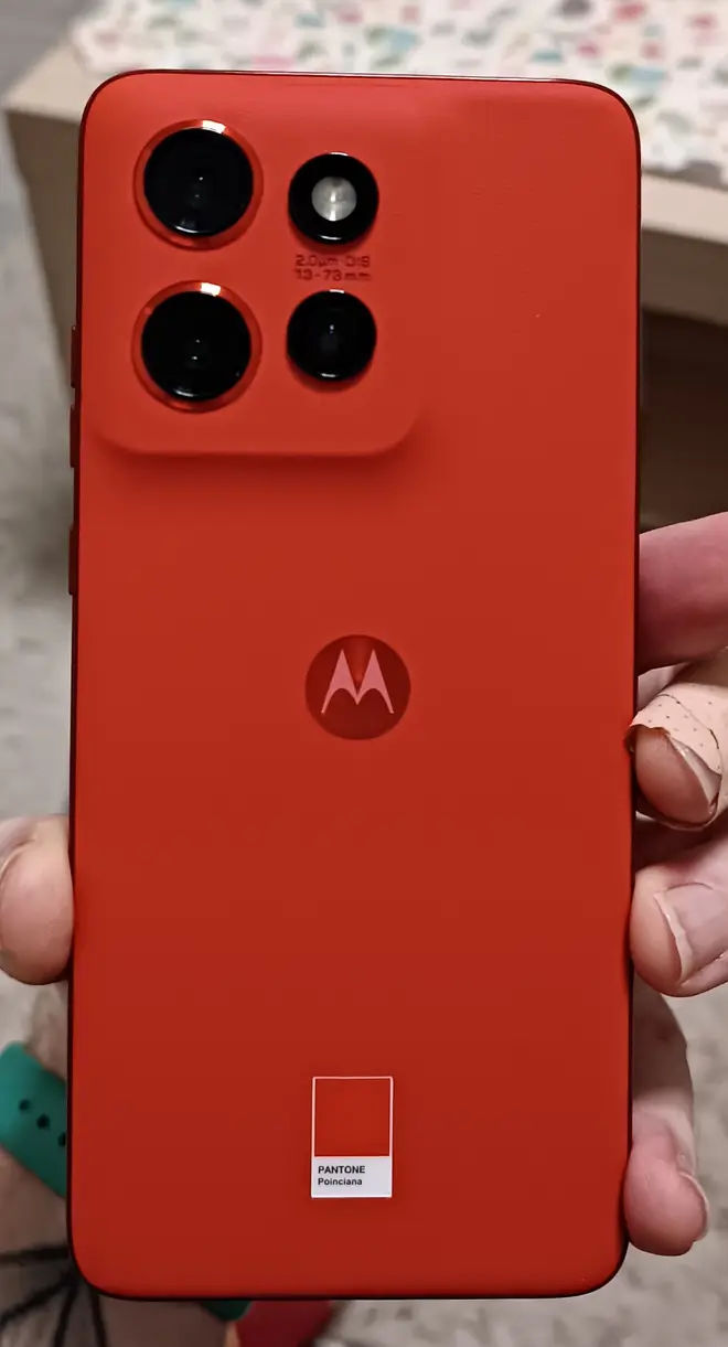 Motorola smartphone standing tall showing its slim profile and rear camera housing