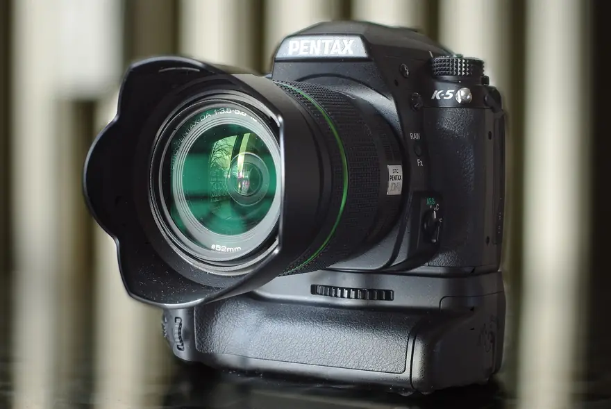 Pentax DSLR camera showing its optical viewfinder hump and rugged weather sealed body