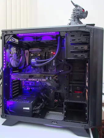 Workstation tower with side panel off showing liquid cooling hardware