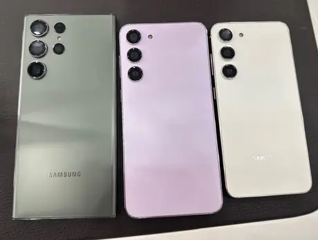 Samsung Galaxy phones displayed together on a dark background