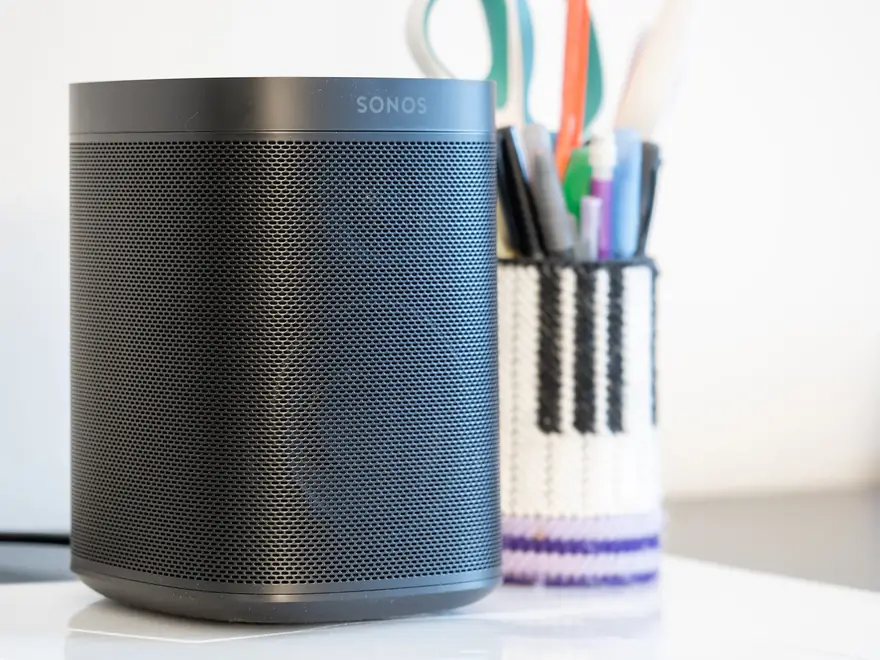 Sonos wireless speakers arranged on a media console in a bright living room
